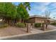 Tan house with desert landscaping and a two-car garage at 3799 N 154Th Dr, Goodyear, AZ 85395