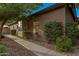 Exterior view of the home with well-maintained landscaping and a charming sidewalk at 3799 N 154Th Dr, Goodyear, AZ 85395