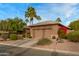 House exterior with a two-car garage and red flowering bushes at 3799 N 154Th Dr, Goodyear, AZ 85395