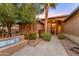 Charming home exterior featuring a landscaped yard, desert plants and a welcoming front entrance with a view to the front door at 3799 N 154Th Dr, Goodyear, AZ 85395