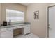 Functional laundry area with ample countertop space, cabinetry, and a sink at 3799 N 154Th Dr, Goodyear, AZ 85395