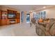 Cozy living room with built-in shelving, a fireplace, and sliding glass doors to the outside at 3799 N 154Th Dr, Goodyear, AZ 85395