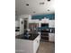 Modern kitchen featuring stainless steel appliances and a large kitchen island at 400 W Wisteria Pl, Chandler, AZ 85248