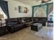 Relaxing living room with a large sectional sofa and decorative accents at 400 W Wisteria Pl, Chandler, AZ 85248