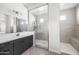 Spa-like bathroom with a large walk-in shower, modern vanity, and neutral tile at 6659 N 127Th Dr, Glendale, AZ 85307