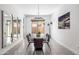 Modern dining room with large mirrors and a rectangular dining table at 6659 N 127Th Dr, Glendale, AZ 85307