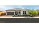 Single-story home with a two-car garage and well-manicured landscaping at 6659 N 127Th Dr, Glendale, AZ 85307