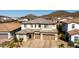 Two-story house with a three-car garage, desert landscaping, and mountain views at 7250 W Pinnacle Vista Dr, Peoria, AZ 85383