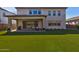 Large backyard with covered patio, artificial turf and a view of the house at 7250 W Pinnacle Vista Dr, Peoria, AZ 85383