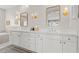 Elegant bathroom with double vanity, a large mirror, and modern fixtures at 7250 W Pinnacle Vista Dr, Peoria, AZ 85383