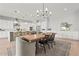 Kitchen dining area features a large wooden table and white cabinetry at 7250 W Pinnacle Vista Dr, Peoria, AZ 85383