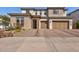 Two-story home with a three-car garage and desert landscaping at 7250 W Pinnacle Vista Dr, Peoria, AZ 85383