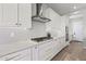 Modern kitchen with white cabinets, quartz countertops and a gas cooktop at 7250 W Pinnacle Vista Dr, Peoria, AZ 85383