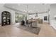 Bright kitchen with an island, white cabinets, and a wooden dining table at 7250 W Pinnacle Vista Dr, Peoria, AZ 85383