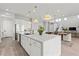 Open concept kitchen with large island and white cabinets at 7250 W Pinnacle Vista Dr, Peoria, AZ 85383