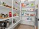 Well-organized pantry with ample shelving for food storage at 7250 W Pinnacle Vista Dr, Peoria, AZ 85383