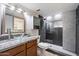 Modern bathroom with glass shower and granite vanity at 7940 E Camelback Rd # 404, Scottsdale, AZ 85251