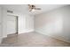 Bedroom with mirrored closet doors and ceiling fan at 7940 E Camelback Rd # 404, Scottsdale, AZ 85251