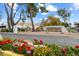 Scottsdale Shadows community entrance with landscaping and signage at 7940 E Camelback Rd # 404, Scottsdale, AZ 85251