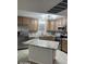 Well-lit kitchen with stainless steel appliances, granite countertops and light wood cabinets at 7940 E Camelback Rd # 404, Scottsdale, AZ 85251