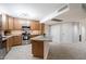 Modern kitchen with wood cabinets and granite island at 7940 E Camelback Rd # 404, Scottsdale, AZ 85251