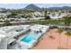 Community pool with surrounding patio and seating at 7940 E Camelback Rd # 404, Scottsdale, AZ 85251