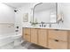 Modern bathroom with floating vanity, black matte fixtures, and an arched mirror at 8437 E San Miguel Ave, Scottsdale, AZ 85250