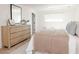 Light and airy bedroom with a neutral color palette and dresser at 8437 E San Miguel Ave, Scottsdale, AZ 85250