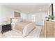 Spacious bedroom with light walls, plush bedding, and built-in shelving at 8437 E San Miguel Ave, Scottsdale, AZ 85250