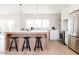 Bright kitchen features a center island with seating and light wood cabinets at 8437 E San Miguel Ave, Scottsdale, AZ 85250