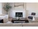 Living room with fireplace and seating area, hardwood floors at 8437 E San Miguel Ave, Scottsdale, AZ 85250