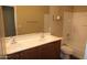 Guest bathroom with double sinks and bathtub at 8808 W State Ave, Glendale, AZ 85305