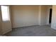 Well-lit bedroom with neutral walls and carpet flooring at 8808 W State Ave, Glendale, AZ 85305