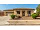 Charming single-story home with a two-car garage and a well-manicured front yard at 8808 W State Ave, Glendale, AZ 85305