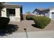 Landscaped front yard with shrubs and gravel at 8808 W State Ave, Glendale, AZ 85305