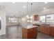 Bright open kitchen featuring an island, stainless steel appliances, and ample countertop space at 8808 W State Ave, Glendale, AZ 85305