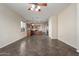 Expansive living area with tile flooring seamlessly transitions to the well-appointed kitchen, creating an ideal space at 8808 W State Ave, Glendale, AZ 85305