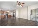 Open-concept living area connecting to the kitchen, featuring tile flooring and modern lighting at 8808 W State Ave, Glendale, AZ 85305