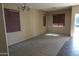 Bright living room featuring neutral walls and carpet flooring at 8808 W State Ave, Glendale, AZ 85305