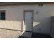 Exterior storage shed with a white door at 8808 W State Ave, Glendale, AZ 85305