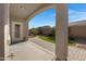 Covered patio, grassy area, and brick pavers at 931 S Porter Ct, Gilbert, AZ 85296