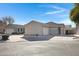 Front view of a light brown house with a garage at 931 S Porter Ct, Gilbert, AZ 85296