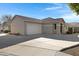 Tan house with a two-car garage and driveway at 931 S Porter Ct, Gilbert, AZ 85296