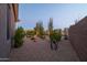 Landscaped backyard with desert plants and modern art at 9771 E Roadrunner Dr, Scottsdale, AZ 85262