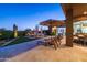 Enjoy desert evenings on this expansive patio with seating and a hot tub at 9771 E Roadrunner Dr, Scottsdale, AZ 85262