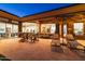 Relaxing patio with lounge chairs and views into the home's interior at 9771 E Roadrunner Dr, Scottsdale, AZ 85262