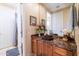 Elegant bathroom with dark vanity and vessel sink at 9771 E Roadrunner Dr, Scottsdale, AZ 85262