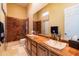 Elegant bathroom featuring double sinks and a marble shower at 9771 E Roadrunner Dr, Scottsdale, AZ 85262