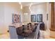 Formal dining room with modern light fixture and statement artwork at 9771 E Roadrunner Dr, Scottsdale, AZ 85262