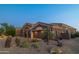 House exterior with desert landscaping and garage at 9771 E Roadrunner Dr, Scottsdale, AZ 85262